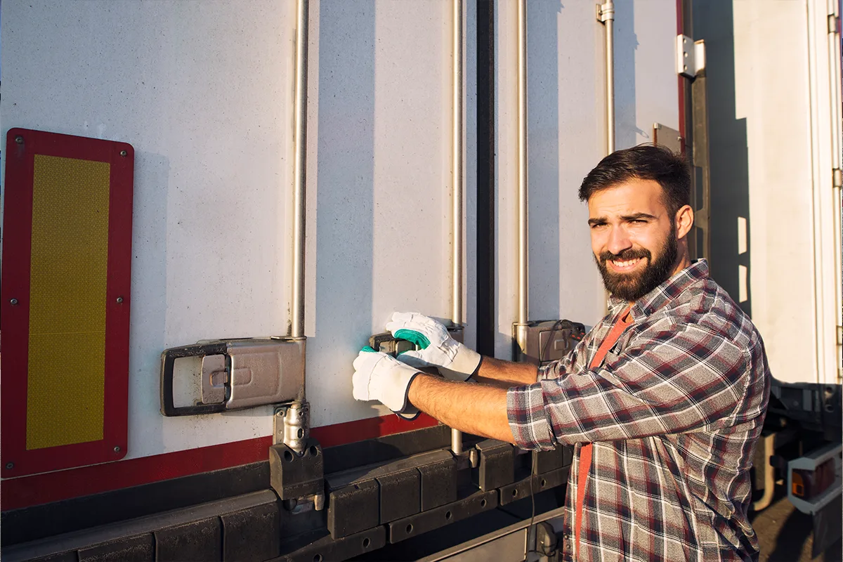 Reefer-driver-opening-a-temperature-controlled-trailer